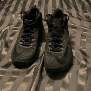 All black Nike basketball shoes